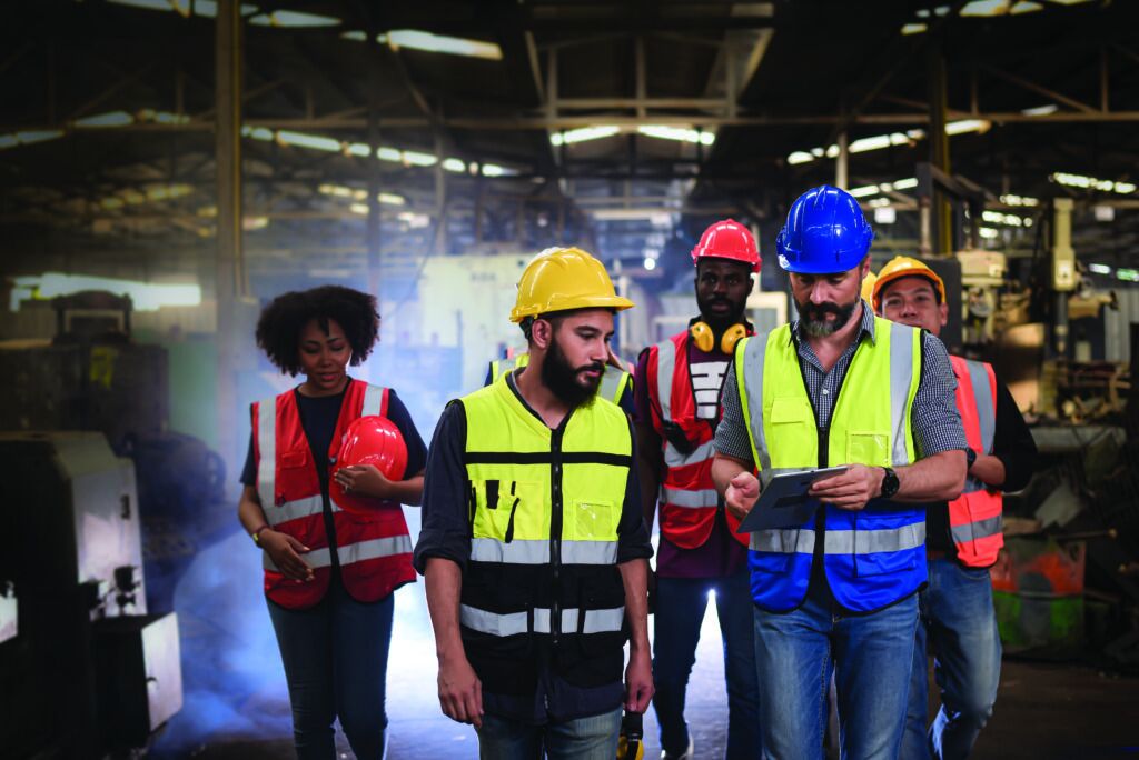 Team reviewing workplace safety analytics illustrating how EHS-LMS integration supports informed training decisions.