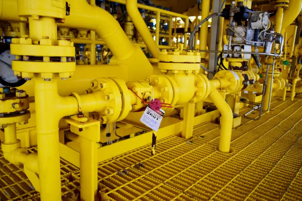 Electrical disconnect switch secured with multiple LOTO padlocks labelled “Danger—Locked Out.”