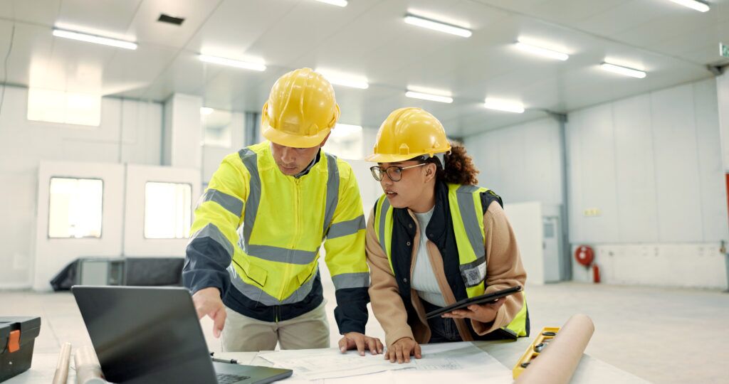 Two Engineers working on a plan