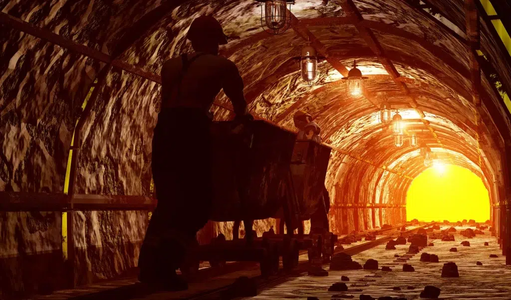 Specialist pushing MIne Cart in Mine Shaft