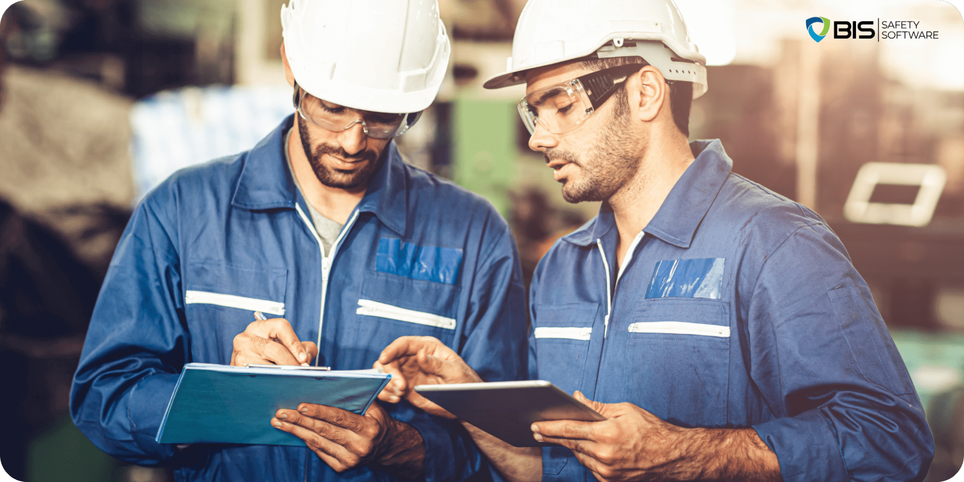 Two Workers at a Construction site, discussing their duties | BIS Safety Software