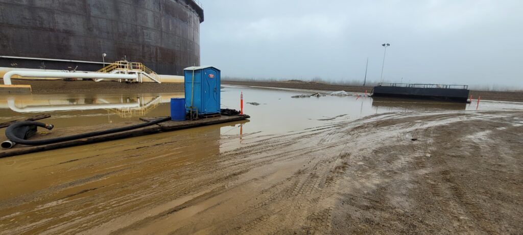 High-risk industrial tank cleaning environment where people-first safety leadership helps crews manage confined space and operational hazards.