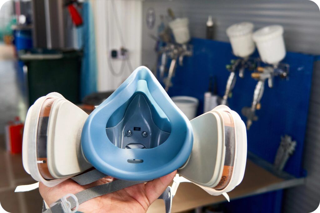 Close-up view of a reusable half-face respirator prioritized for workplace respiratory protection.